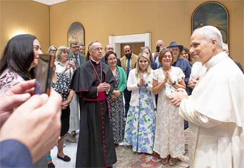 Pope Leo XIV talks with Archbishop Charles C. Thompson of Indianapolis and members of a pilgrimage organized by the U.S. bishops' Committee for Evangelization and Catechesis for the Jubilee of Catechists at the Vatican Sept. 27, 2025. (CNS photo/Vatican Media)