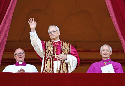 Pope Leo XIV, the former Cardinal Robert F. Prevost, waves to the crowds in St. Peter's Square at the Vatican after his election as pope May 8, 2025. The new pope was born in Chicago. (CNS photo/Vatican Media)