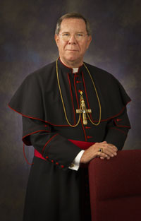 Archbishop Buechlein standing