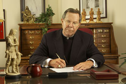 Archbishop Buechlein at his desk