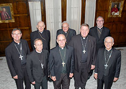 Eight Indiana bishops gather in May 2014 in Lafayette for a provincial meeting and a meeting with the executive director of the Indiana Catholic Conference. They are, from front left: Bishop Timothy L. Doherty of Lafayette; Bishop Charles C. Thompson of Evansville; Bishop Kevin C. Rhoades of Fort Wayne-South Bend; Archbishop Joseph W. Tobin, CSsR, of Indianapolis and Bishop Dale J. Melczek, of Gary. Behind them, from left to right, are Bishop Emeritus William L. Higi, of Lafayette; Bishop Emeritus Gerald A. Gettelfinger, of Evansville and Bishop Christopher Coyne, auxiliary bishop of Indianapolis. As they are retired, Bishops Gettelfinger and Higi were not signatories of this statement. 