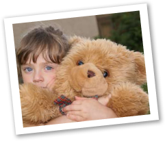 Little girl holding a bear