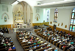 Archbishop Joseph W. Tobin addresses about 300 people during a press conference at St. Louis Church in Batesville on June 6, 2013.