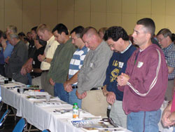 Men prayer during conference