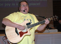 Grace On Demand founder Austin Rahill, the youth ministry coordinator at Mary, Queen of Peace Parish in Danville, leads the music during the Archdiocesan Youth Rally Mass on March 5 at Cathedral High School in Indianapolis. Grace On Demand band members and St. Vincent de Paul Parish youth ministry coordinator Dave Gehrich of Shelbyville recently started an “Ador-Rally” youth ministry program that will bring eucharistic adoration to teenagers and young adults at archdiocesan parishes.
