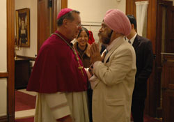 Archbishop Daniel M. Buechlein chats with K. P. Singh, a member of the Sikh Satsang of Indianapolis, after the seventh annual Interfaith Thanksgiving Service held on Nov. 21 at SS. Peter and Paul Cathedral in Indianapolis.