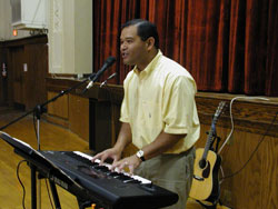 Catholic musician Tony Avellana sings during a youth rally on Respect Life Sunday on Oct. 5, 2003. He plays the piano, synthesizer, guitar and violin, and has sold 6,000 copies of his “Journey Songs” CD. (File photo by Mary Ann Wyand) 