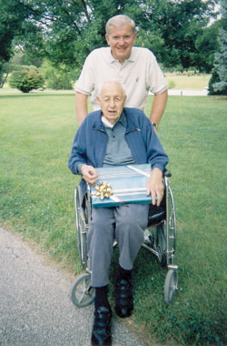 Father John Mannion and Charlie Ressler celebrate Father’s Day in 2006. (Submitted photo) 