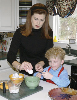 Jenni Egger gets help from her son, Charlie, as they make Veggie Filled Frittata, a meatless meal for a Lenten Friday. (Submitted photo) 