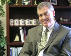 Bill Sahm discusses the future of Bishop Chatard High School in an office at the Indianapolis North Deanery school.