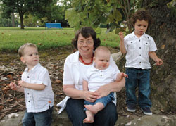 Holy Spirit parishioner Diana Hay of Indianapolis poses for an informal portrait with her active grandsons, from left, Aaron Baker, Daniel Baker and Dylan Mercado, at Ellenberger Park in Indianapolis. Hay plans to visit her daughters, Julie Mercado and Kimberly Baker, and her grandchildren in Dayton, Ohio, this weekend to celebrate Mother’s Day.