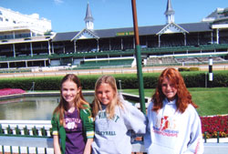 Jack and Marie Fink’s granddaughters, Claire Meyerhoff of St. Louis, from left, and Hannah and Hilary Fink of Fort Wayne, Ind., tour Churchill Downs in Louisville, Ky., and the Kentucky Derby Museum there on a quiet day at the world-famous racetrack. (Photo by Marie Fink) 