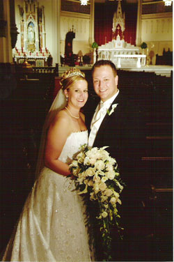 Steve and Lindsey Kovecsi celebrate their wedding at St. John the Evangelist Church in Indianapolis, one of the most desired churches in Indiana for a wedding.