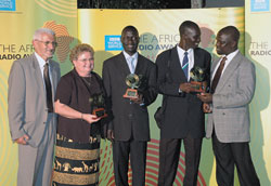 Comboni Father Tonino Pasolini, left, station director of Radio Pacis in Arua, Uganda, accepts the British Broadcasting Corporation’s award for “Best New Radio Station in Africa” with Indianapolis native Sherry Meyer, station manager; assistant news editor Dranibo Felix; assistant program manager Driliga George; and program manager Anecho Sam on May 26 in Nairobi, Kenya. The BBC said “Radio Pacis is a fine example of what a community radio station based outside the capital can do.” (Submitted photo) 