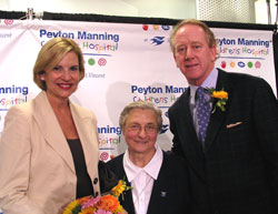 Daughter of Charity Mary John Tintea, center, poses with Peyton Manning’s parents, Olivia and Archie, at a Sept. 5 press conference announcing the renaming of St. Vincent Children’s Hospital for the Indianapolis Colts’ quarterback.