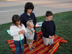 St. Luke parishioner Ann Green and her children, Mary, John Paul and Jimmy, of Indianapolis, pray outside the Planned Parenthood clinic, the largest abortion facility in the state, on Oct. 2 during the first “40 Days for Life” prayer campaign in the archdiocese.