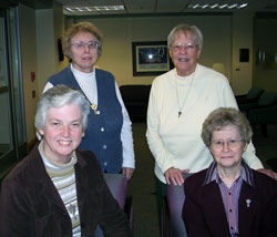 Four members of the Sisters of the Third Order of St. Francis who are parish life coordinators in the archdiocese pose for a photo at their congregation’s motherhouse in Oldenburg. Sister Margie Niemer, front row, left, leads St. Peter Parish in Franklin County. Sister Shirley Gerth, front row, right, leads St. Anne Parish in New Castle and St. Rose Parish in Knightstown. Sister Christine Ernstes, back row, left, leads Immaculate Conception Parish in Millhousen and St. Denis Parish in Jennings County. Sister Patty Campbell, back row, right, leads St. Mary-of-the-Rock Parish in Franklin County. (Submitted photo) 