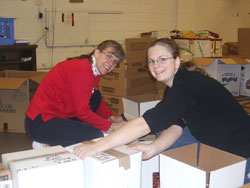 Benedictine Sister Jennifer Mechtild Horner, left, helps sort boxes with University of Indianapolis student Michelle Stephens during a community service project at Gleaners Food Bank in Indianapolis. (Submitted photo) 