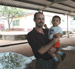 Seminarian Chris Wadelton holds a boy who is a resident of the Pedro Atala orphanage in Tegucigalpa, Honduras, during a mission trip he took in the summer of 2006. (Submitted photo) 