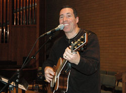 Catholic musician Steve Angrisano of Highlands Ranch, Colo., sings during a youth ministry gathering on Feb. 20, 2007, at St. Matthew the Apostle Church in Indianapolis. He is the keynote presenter for the 2008 Archdiocesan High School Youth Rally on March 2 at Bishop Chatard High School in Indianapolis. Teenage musicians from St. Mark the Evangelist Parish in Indianapolis will assist Angrisano as the house band for the youth rally. (File photo by Mary Ann Wyand)	