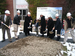 Participating in the Feb. 24 groundbreaking ceremony at St. Lawrence Parish in Indianapolis are, from left, Bob Schultz, chair of the parish’s Legacy for Our Mission: For Our Children and the Future campaign; Greg Stephens, chair of the parish building committee; Father John Beitans, pastor; Emily Barnes, youth representative from St. Lawrence School; Betty Popp, principal of St. Lawrence School; Lisa Winbusch-Roach, chair of the St. Lawrence Pastoral Council; Michael Egan, chief architect from Entheos Architects; and Tim Berry of Meyer-Najem Construction. (Submitted photo) 