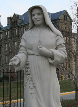 A marble statue of St. Theodora Guérin, the foundress of the Sisters of Providence of Saint Mary-of-the-Woods, stands outside of the Basilica of the National Shrine of the Immaculate Conception in Washington. The statue was sculpted by Teresa Clark of Terre Haute and carved by Nicholas Fairplay of Oberlin, Ohio. The statue will be dedicated on May 10. (Photo by Melissa Scarlett)