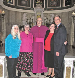 Standing with Msgr. Joseph F. Schaedel, vicar general, in Blessed Sacrament Chapel of SS. Peter and Paul Cathedral in Indianapolis on May 15 are the most recent to complete the archdiocese’s Ecclesial Lay Ministry formation program. Pictured, from left, Cathy Louden, Maureen Shea, Msgr. Schaedel, Ann Northam and Ed Isakson. (Photo by Mike Krokos)