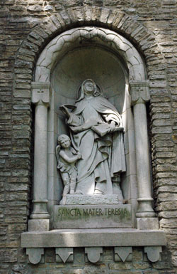 This statue of St. Teresa of Avila, also known as St. Teresa of Jesus, graces an alcove on the front wall of the Carmelite Monastery of the Resurrection in Indianapolis. In 2007, the Indianapolis Carmel marked 85 years as a Carmelite foundation, first in New Albany then 75 years of contemplative prayer at the monastery at 2500 Cold Spring Road. (Photo by Mary Ann Wyand) 