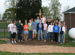 Members of St. Vincent de Paul Parish’s youth group provided much of the labor for the installation of the parish’s new Stations of the Cross path. Chris Haunert, left, coordinated the service project. (Photos by Melinda Haunert) 