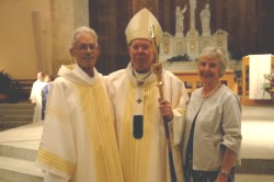 Deacon Ronald Stier and his wife, Donna, pose with Archbishop Daniel M. Buechlein on June 28 in SS. Peter and Paul Cathedral in Indianapolis on the day of Deacon Stier’s ordination as a member of the first class of permanent deacons in the history of the Archdiocese of Indianapolis. Deacon Stier ministered at the Richmond Catholic Community parishes of Holy Family, St. Andrew and St. Mary, and at the Wayne County Jail. (Photo by Mary Ann Wyand) 
