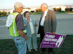 St. Luke the Evangelist parishioner John Hanagan of Indianapolis, left, talks with St. Bartholomew parishioner Eileen Hartman of Columbus, director of The Gabriel Project, a pro-life ministry for women experiencing crisis pregnancies, and Jim Sedlak, vice president of the American Life League and coordinator of STOPP, on Oct. 1, 2007, outside the Planned Parenthood abortion clinic (not pictured) at 8590 Georgetown Road in Indianapolis. (File photo by Mary Ann Wyand) 