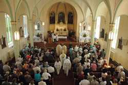 Archbishop Daniel M. Buechlein processes into St. Paul Church in New Alsace on Sept. 7 at the start of a Mass to celebrate the 175th anniversary of the founding of the Batesville Deanery parish. (Photo by Sean Gallagher) 