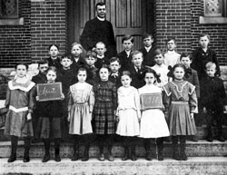 Students at St. Mary School in Greensburg pose outside their school building in 1910 with the parish’s pastor, Father Lawrence Fichter. The Batesville Deanery parish is celebrating the 150th anniversary of its founding this year. (Submitted photo) 