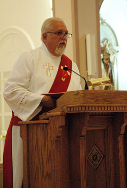 Deacon William Jones, who is a member of St. Bartholomew Parish in Columbus, preaches the homily during an archdiocesan Substance Addiction Ministry healing Mass on Sept. 14 at Holy Cross Church in Indianapolis. He shared his story of recovery from alcohol addiction, and quoted St. Augustine, who wrote that, “Our pilgrimage on earth cannot be exempt from trial. … No one knows himself except through trial or receives a crown except after victory.” (Photo by Mary Ann Wyand) 
