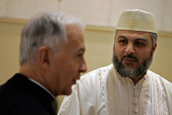 Bishop Dale J. Melczek of Gary, Ind., and Imam Mongy El Quesny of the Northwest Indiana Islamic Center chat on Oct. 26 at the center in Crown Point during the opening session of the 2008 Midwest Muslim-Catholic Dialogue. This was the first time that the Diocese of Gary hosted the interreligious dialogue. (Photo by Tim Hunt,)