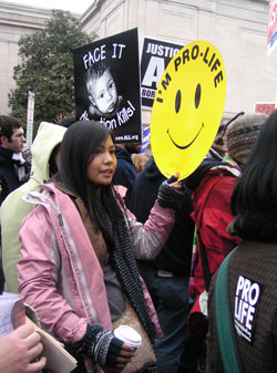 Jacinta Dela Cruz, a member of St. Patrick Parish in Terre Haute, shows her commitment to unborn children as she marches with archdiocesan pilgrims during the 2007 March for Life in Washington, D.C. (Submitted photo) 