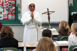 Daughters of Mary Mother of Mercy Sister Loretto Emenogu, a native of Nigeria, presents a mission talk to religious education students on Nov. 23, 2008, at St. Jude Parish in Indianapolis. Sister Loretto was named mission educator for the archdiocesan Mission Office on July 1, 2008, when Sister Demetria Smith, a Missionary Sister of Our Lady of Africa, retired. (Photo by Mary Ann Wyand) 