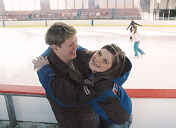 Katie Stamper, right, and her mother, Bernadette Reilly, share a moment of joy at the Pan American Plaza Skating Rink in Indianapolis. At 17, Katie is one of five Indiana athletes chosen to compete in the 2009 Special Olympics World Winter Games, an international competition featuring 3,000 athletes from 100 countries that will begin on Feb. 7 in Boise, Idaho. Katie views her participation as part of God’s plan for her. (Photo by John Shaughnessy) 