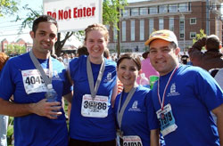 Roger Neal, left, Julie Johnstone, Gabrielle Campo and Anthony Campo, all members of last year’s Run for Vocations Team, pose together after completing the 2008 One America 500 Festival Mini-Marathon in Indianapolis. (Submitted photo) 