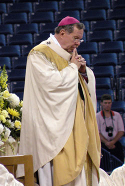 Archbishop Buechlein praying at the Mass