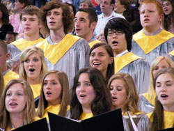 Members of a high school choir made up of students from Cardinal Ritter Jr./Sr. High School, Bishop Chatard, Roncalli, Father Thomas Scecina Memorial and Cathedral high schools, all in Indianapolis, sing prior to the start of the 175th anniversary Mass at Lucas Oil Stadium in Indianapolis on May 3. (Photo by Brandon A. Evans) 