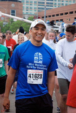 Seminarian Martin Rodriguez, a senior at Bishop Simon Bruté College Seminary and member of St. Mary Parish, both in Indianapolis, takes part in the One America 500 Festival Mini-Marathon on May 2. (Photo by Jessica Geisler) 