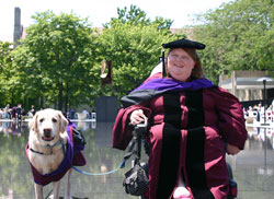 Katrina Gossett and Duke, her aid dog, wear their hoods at the University of Chicago Law School graduation ceremonies on June 12. (Submitted photo) 