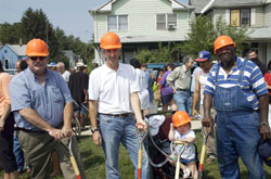 Lucious Newsom and Anna Molloy worked together for years to inspire people to care for the hungry and the needy. In this 2005 photo, Lucious, right, and Anna, second from right, pose during a groundbreaking ceremony for Anna’s House, a community service center in Indianapolis that was created to serve people in need. Charlie Caito, left, and Leo Stenz, two loyal supporters of Anna’s House, participated in the groundbreaking ceremony. (Submitted photo) 
