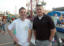 Holy Spirit parishioners Christopher Hess, left, and Justin Lawrence of Indianapolis pose for a photograph on July 9 at the parish festival. They helped three other men organize the summer festival this year in memory of their fathers, Richard “Dick” Hess and Donald “Rex” Lawrence, the longtime festival chairman and assistant chairman, who died earlier this year. Holy Spirit’s festival, which dates back to 1948 as a small event, was expanded in 1954 and continues to grow larger each year. This year’s festival attracted 10,000 people. (Photo by Mary Ann Wyand)