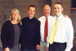 Danny Shine, a graduate of Bishop Chatard High School in Indianapolis stands with his mother, Kate, father, Kevin, and younger brother, Will. Danny is attending Mount St. Mary’s Seminary in Maryland this fall. (Submitted photo)