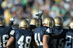 Members of the University of Notre Dame football team’s special teams unit huddle during a home game on Oct. 4, 2008. (Photo courtesy of Notre Dame sports information department)