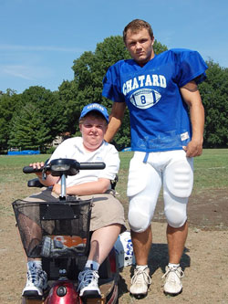 Since their freshman year at Bishop Chatard High School in Indianapolis, Will Kuhn, left, and Mike Goetz have been good friends. The bond between the two seniors is just one of the many special relationships that have developed from Will becoming part of the school’s football team as a manager, and being an inspiration as he moves forward through life despite muscular dystrophy. (Submitted photo by Kelly Lucas)
