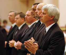 Deacon aspirants, from left, Steven House of St. Bartholomew Parish in Columbus, Thomas Horn of St. Mark the Evangelist Parish in Indianapolis, Thomas Hill of St. Bartholomew Parish in Columbus, Timothy Harte of St. Martin of Tours Parish in Martinsville, Ronald Freyer of St. Louis Parish in Batesville and Richard Cooper of St. Mary Parish in Lanesville participate in the rite of admission to candidacy for the diaconate during the Sept. 19 Mass at SS. Peter and Paul Cathedral in Indianapolis. (Photo by Mary Ann Wyand)