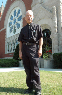 Father William Turner, pastor of St. Mary (Immaculate Conception) Parish in Rushville, stands in front of his parish’s church on Sept. 16. Ordained in 1975, Father Turner has ministered in Catholic high schools and parishes across the archdiocese. (Photo by Sean Gallagher) 